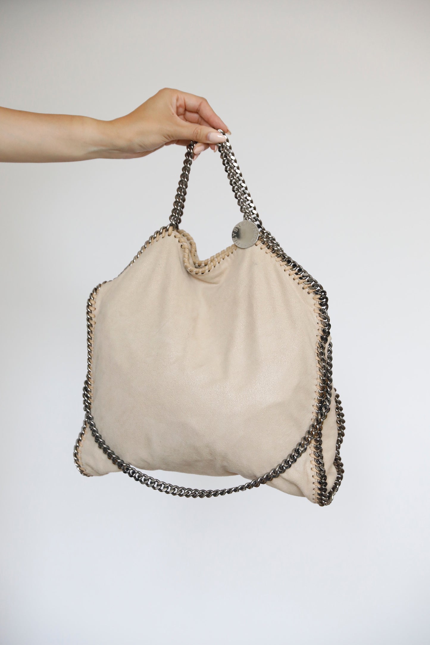 Hauptansicht der beige / creme pre-owned Stella McCartney Falabella – elegantes Statement-Piece.