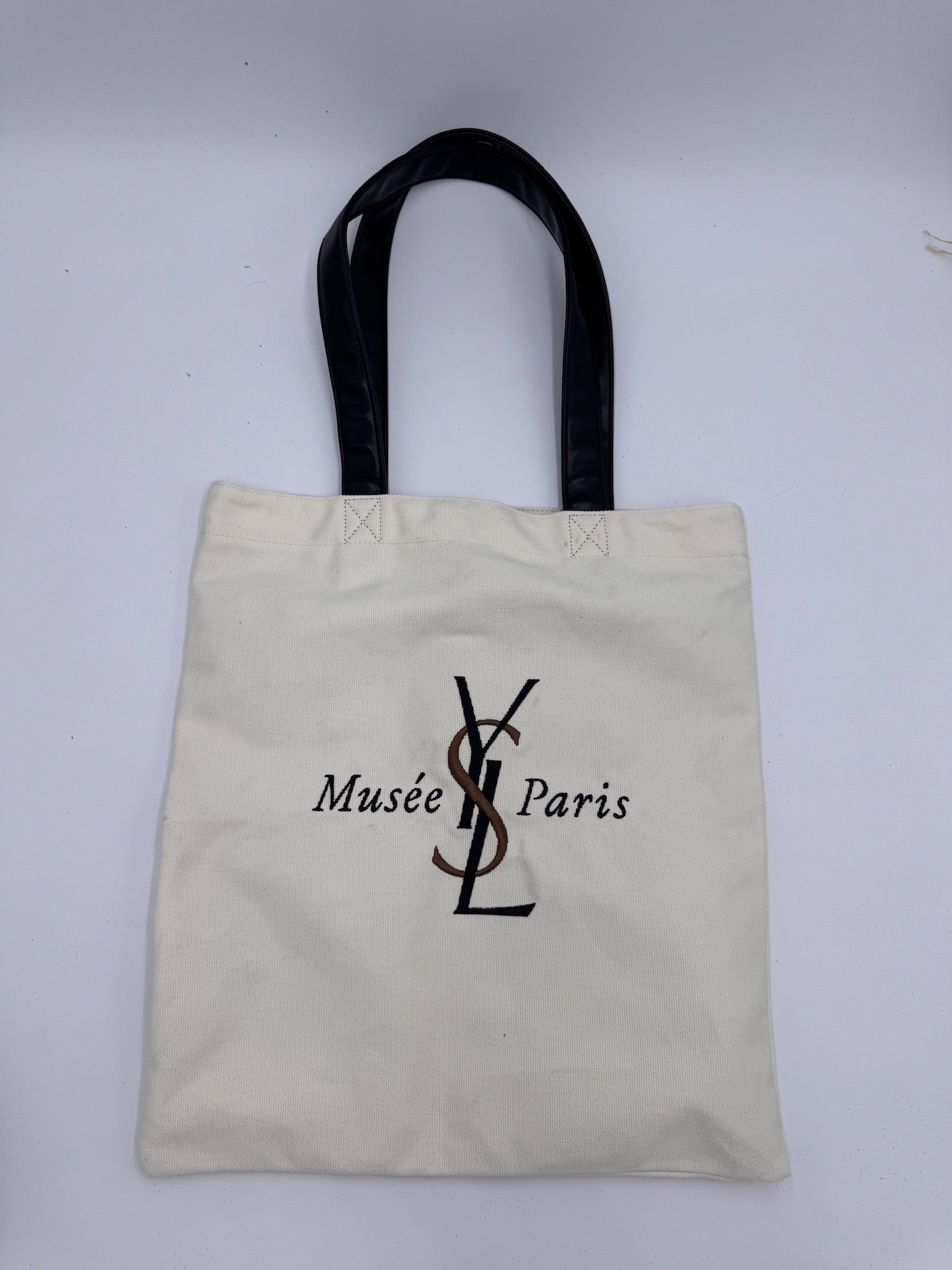Frontalansicht der preloved Saint Laurent Canvas Totebag in Beige.