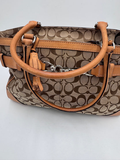 Tragegriffe dieser Gelb Coach Shoulder Bag in Schultertasche-Form.