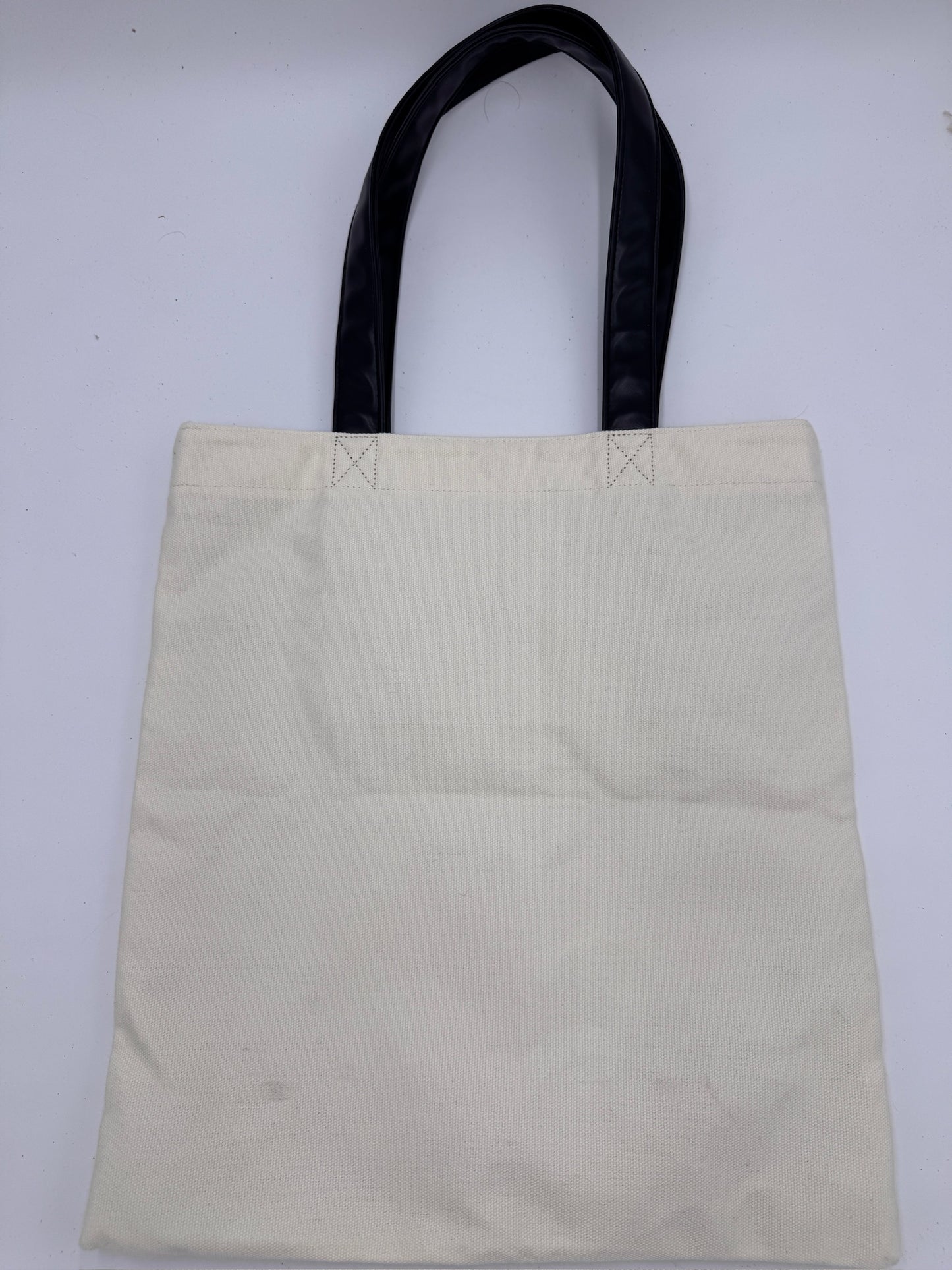 Rückseite der Beige preloved Saint Laurent Canvas Totebag – klassisch & zeitlos.