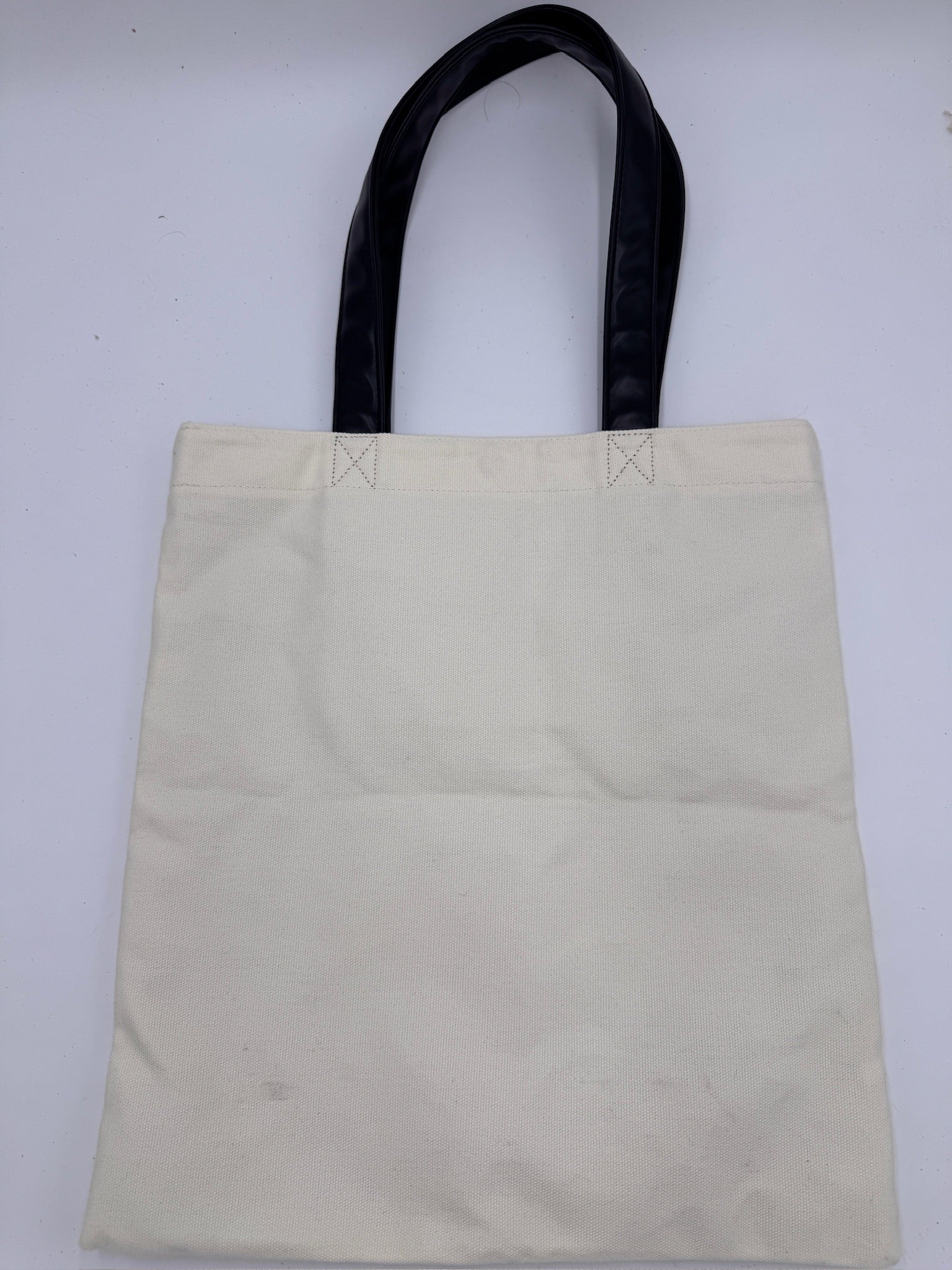 Rückseite der Beige preloved Saint Laurent Canvas Totebag – klassisch & zeitlos.